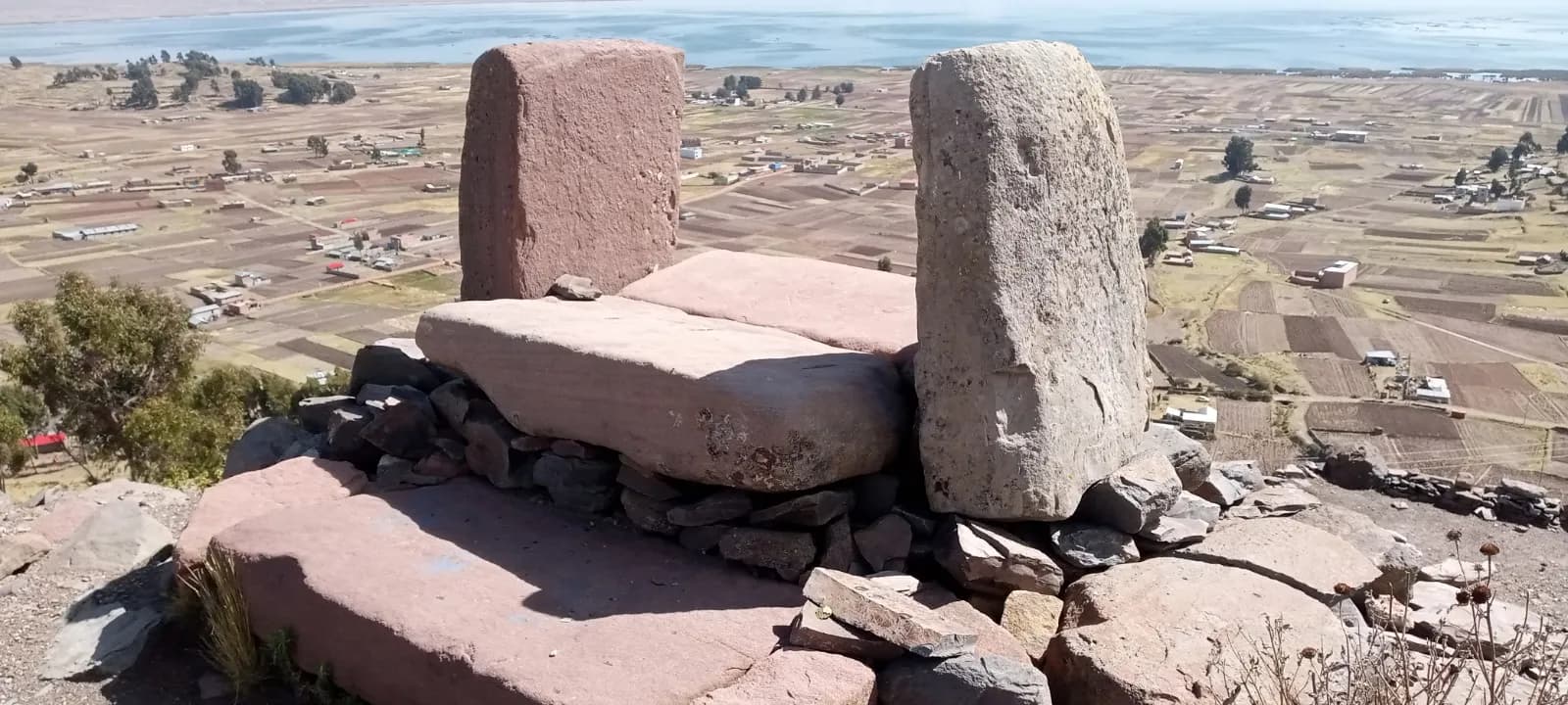 Andean stone altar overlooking Lake Titicaca and the altiplano fields